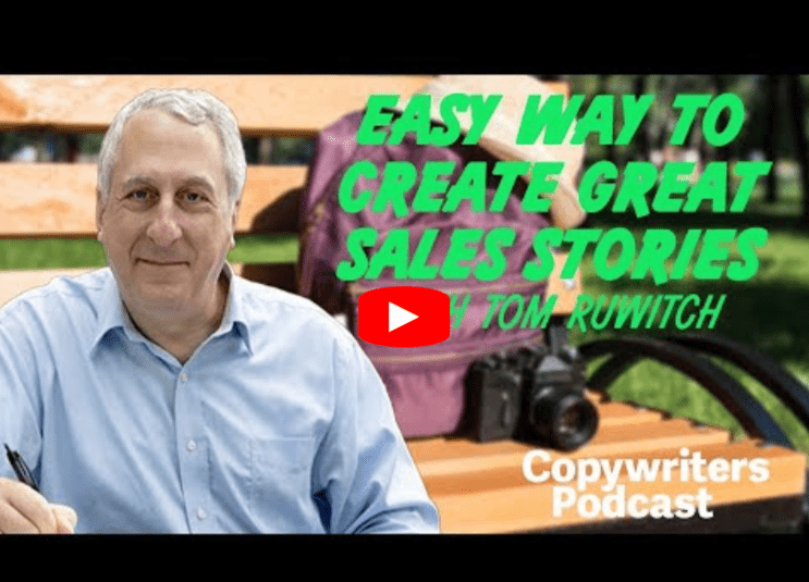 A man sits on a park bench smiling, with a camera and backpack beside him. Text reads: Easy Way to Create Great Sales Stories with Tom Ruwitch. Copywriters Podcast. A YouTube play button is in the center.