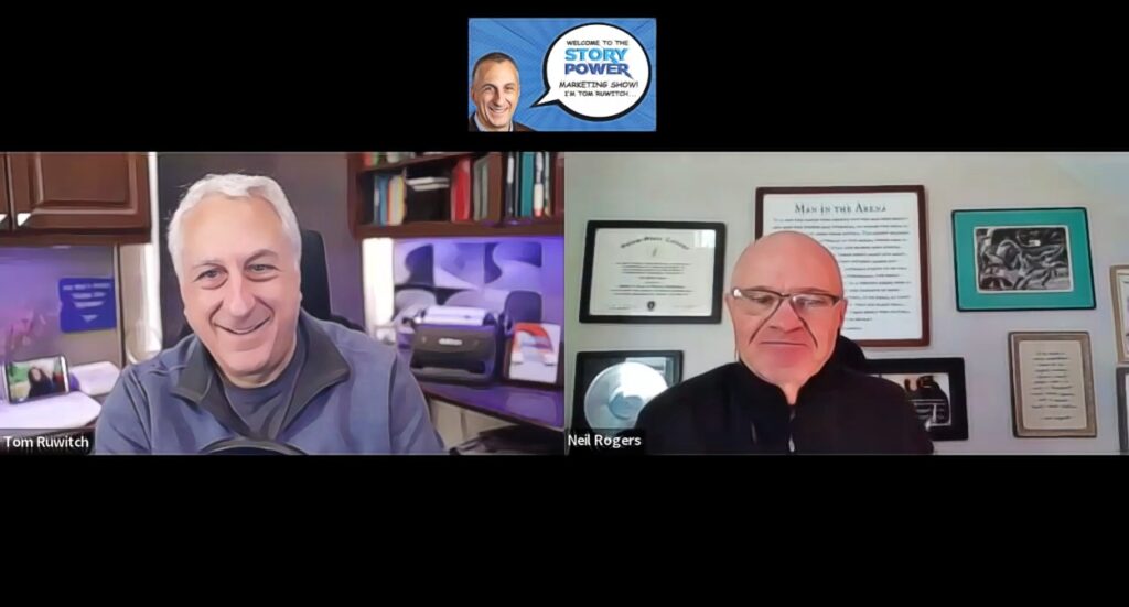 Two men smiling during a virtual video call. Each is in a separate home office with books, certificates, and photos visible behind them. A logo at the top reads “Story Power: A Marketing Show – Host: Tom Ruwitch.”.